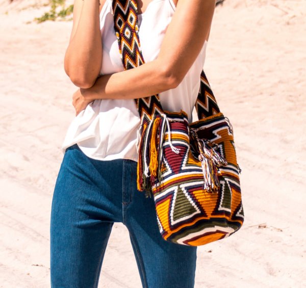 girl in blue jeans wearing Authentic Handmade Colombian Wayuu bag