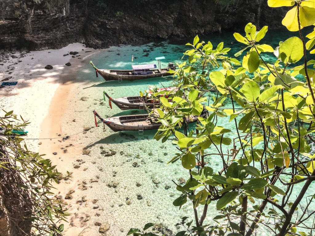 the view on thai boats anchoring at secret beach on koh poda