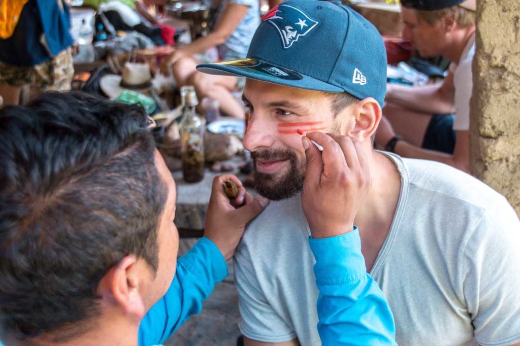 Getting face paint on the inca trail