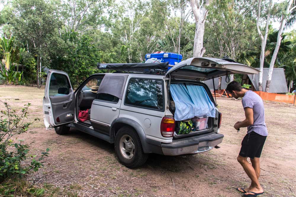 a man preparing a 4WD for camping on magnetic island