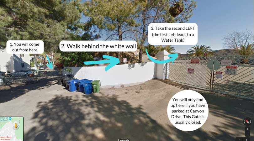 a screenshot of google maps showing a street with trash bins a wall and two gates as well as written instructions for the hollywood sign hike
