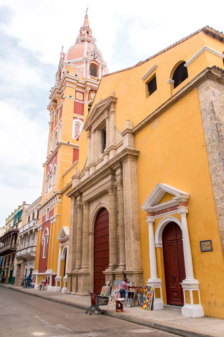 tall orange church with brown doors, pink cappella in Cartagena 