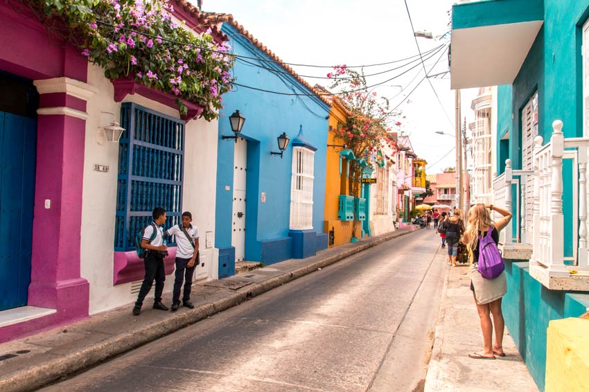 colourful street and two kids talking in Cartagena, Colombia