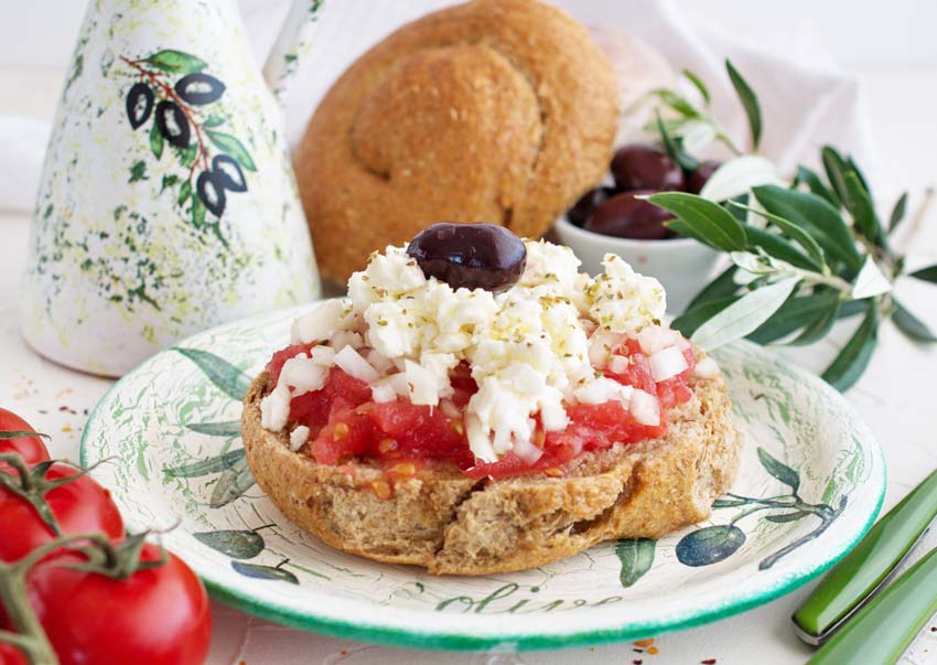 Greek Dakos, baguette filled with cheese, tomatoes and olives
