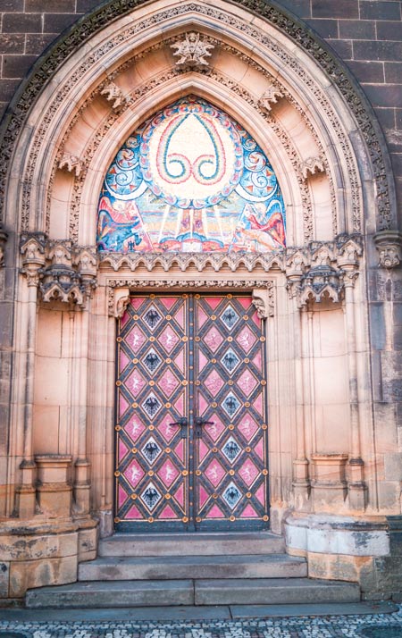 pink door with baroque ornaments